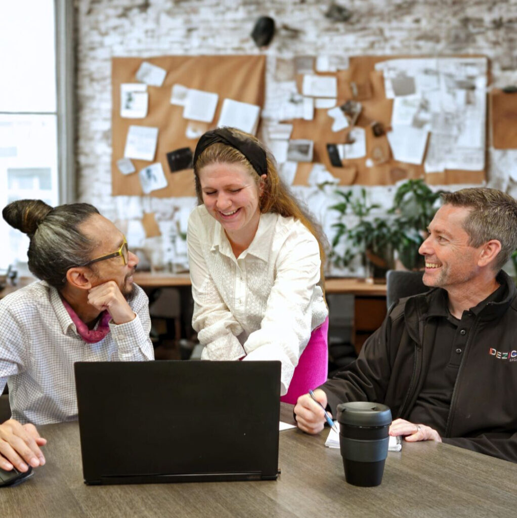 Dezign Digital staff reviewing a digital marketing strategy in the office for a small business in Perth